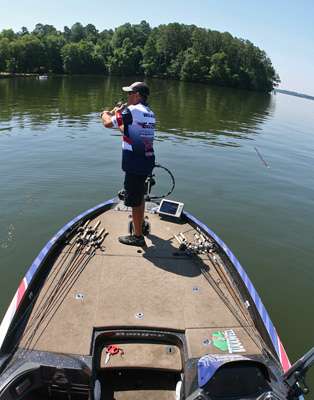 <p>
	David Walker flings a long cast with a big worm as the afternoon sun begins to roast the Decatur area.</p>
