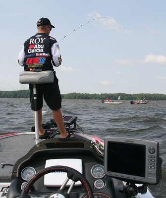 <p>
	 </p>
<p>
	Boats watch the Day Three leader fishing early on the final day of competition.</p>

