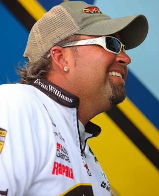 <p>
	Jason Quinn smiles as he listens to Britt Myers account of his day of fishing on Douglas Lake. </p>
