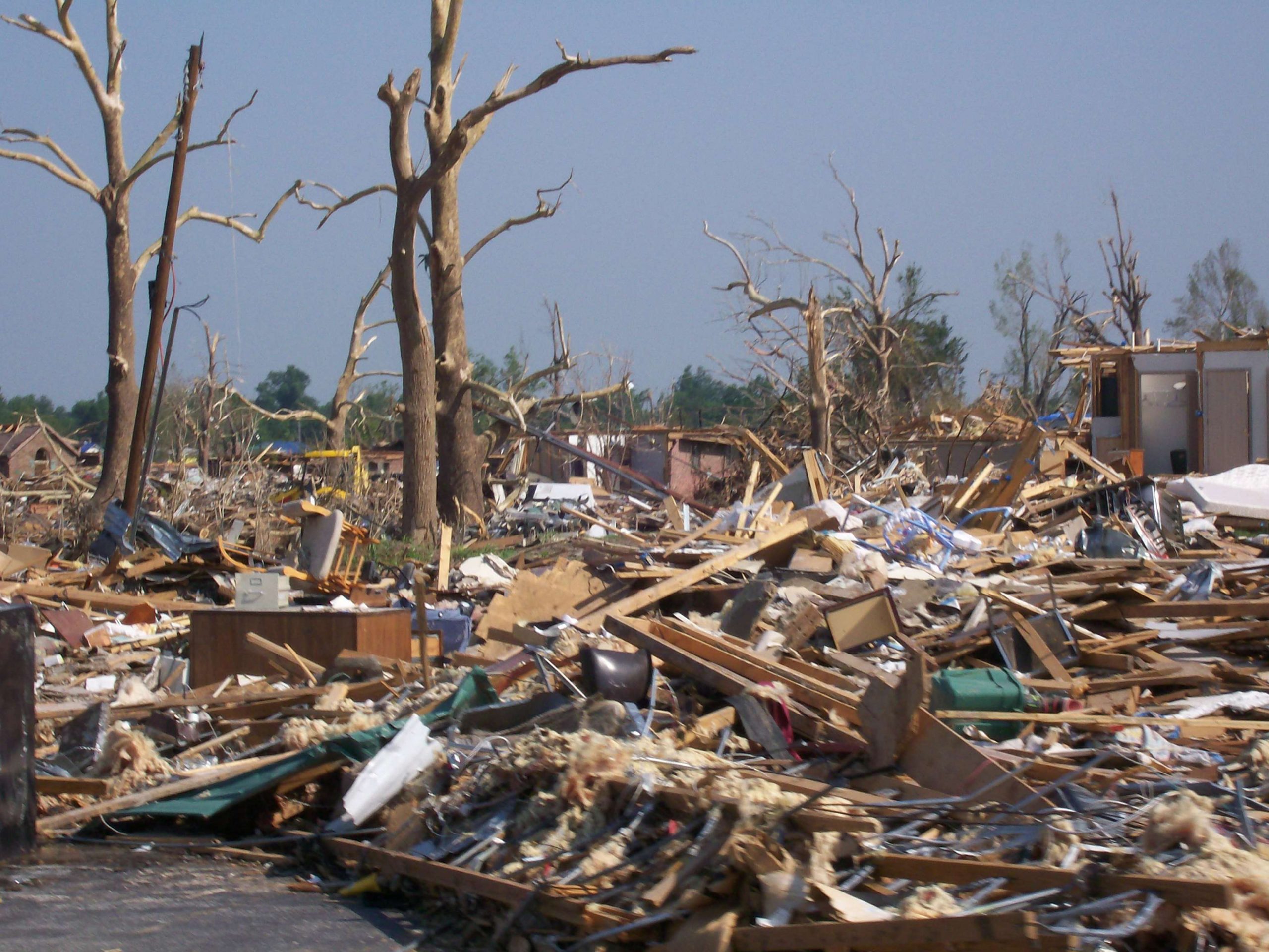 <p>
	Debris piled up in numerous places along the tornadoâs path.</p>
