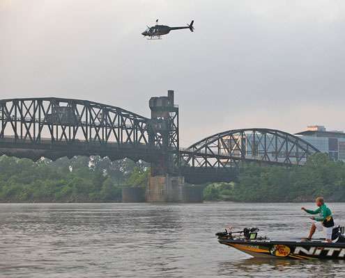 <p>
	 A helicopter full of Bassmaster photographers and cameramen flies over the launch area.</p>
