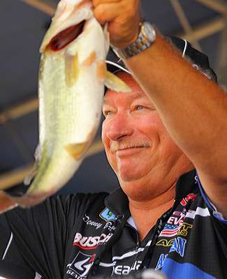 <p>
	Last week's champion Denny Brauer shows his fish, adding that this sport is all about momentum.</p>
