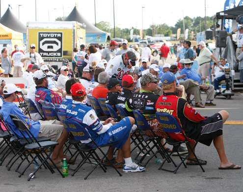 <p>
	Anglers wait for the top-50 meeting to begin at the end of the Day Two weigh-in.</p>
