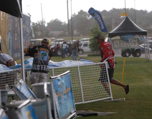 <p>
	Jason Williamson runs to get to cover as the storm hits.</p>
