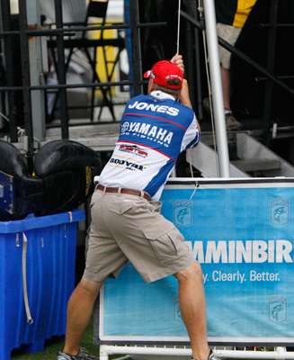 <p>
	 </p>
<p>
	Alton Jones chipped in to help hold down the tent behind the stage.</p>
