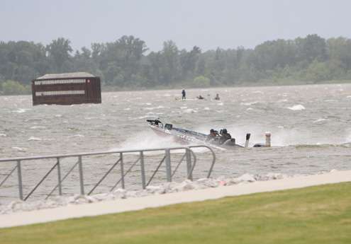 <p>
	 </p>
<p>
	A boat makes its way out from near the check-in area through high waves.</p>
