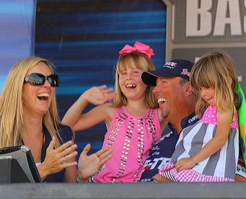 <p>
	David Walker celebrates the victory with his family on stage.</p>
