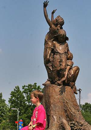 <p>
	Some didn't care, like Parker Ridge, 4, of Little Rock, who hangs out under a statue in the park.</p>
