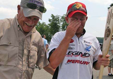 <p>
	Larry Upshaw congratulates his son, Andrew, who again was moved to tears by the victory.</p>
