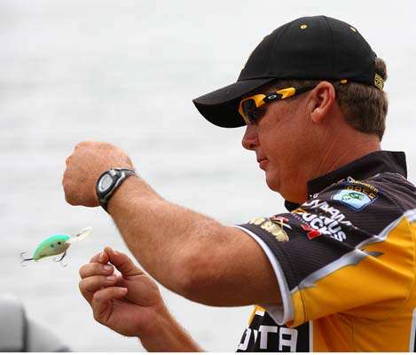 <p>
	Scroggins, hoping to have another good day on Lake Jordan, prepares his tackle.</p>
