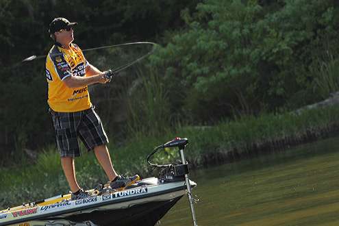<p>
	 </p>
<p>
	Scroggins loads up his rod to bomb another cast out on the Alabama River.</p>
