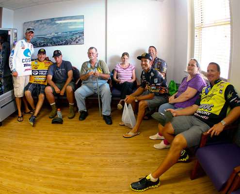 <p>
	 </p>
<p>
	A group of anglers and veterans pose for a picture in one of the waiting areas.</p>
