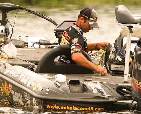 <p> 	Iaconelli places his second keeper into the live well. </p> 