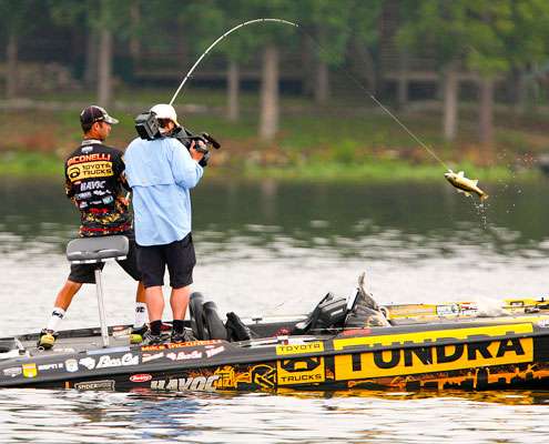 <p> 	Iaconelli lifts keeper number three over the bow of the boat. </p> 