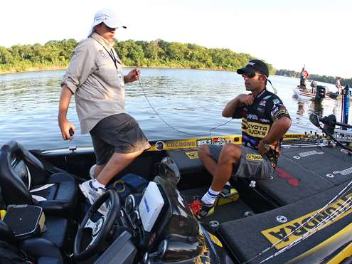 <p>
	Mike Iaconelli has help getting his microphone set as cameras film Toyota Trucks All-Star Week.</p>
