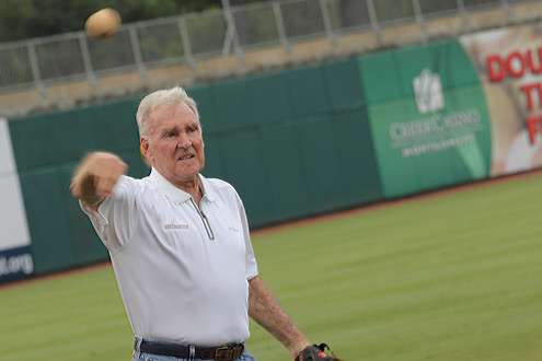 <p>
	Jerry McKinnis warms up his arm before throwing the first pitch at the game.</p>

