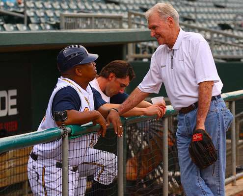 <p>
	Jerry McKinnis chats with some of the Biscuits players before the game.</p>
