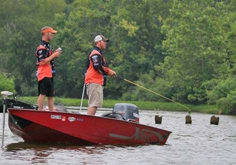 <p>
	 </p>
<p>
	The Oklahoma State team of Travis Snyder and Chuck Major fish near a line of pilings.</p>
