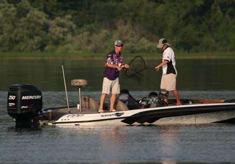 <p>
	 </p>
<p>
	Stephen F. Austin angler Ryan Watkins has a fish on the line as Andrew Upshaw readies the net.</p>
