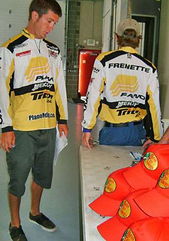 <p>
	 </p>
<p>
	Stephen and Mike Frenette listen to the particulars of the Bass Pro Shop contingency program, which offers a $2,000 gift card to the winning team.</p>
