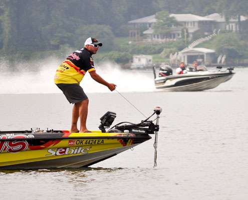<p> 	Dissatisfied with his deep water spot, Jeff Kriet pulls up his trolling motor and prepares to try another spot.</p> 