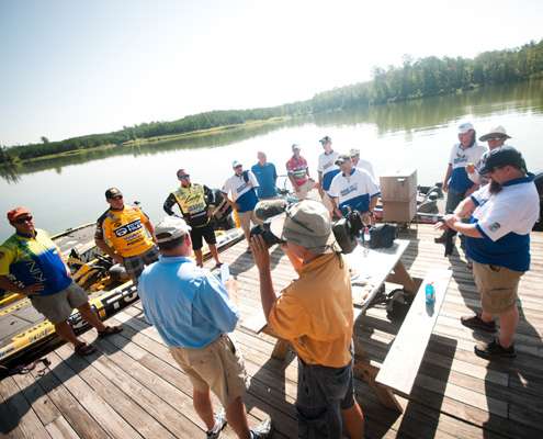 <p>
	The anglers gather at the boat dock to discuss the rules of the tournament.</p>
