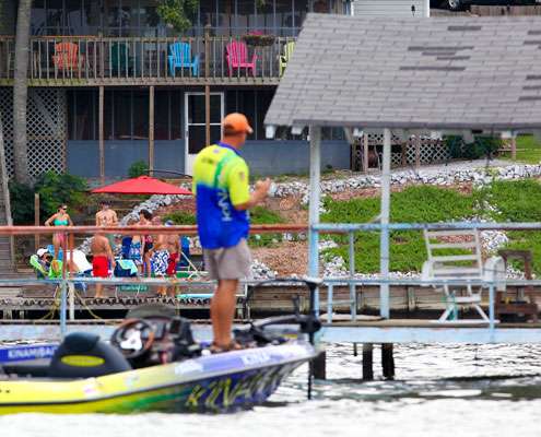 <p>
	Kennedy fished a boat dock while local residents enjoyed a day on Lake Jordan. </p>
