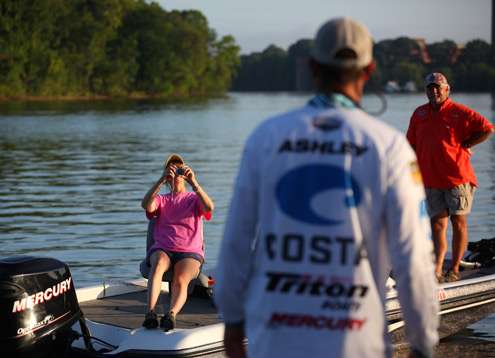 <p>
	Spectators take a picture of Ashley as the sun begins to rise in Montgomery.</p>
