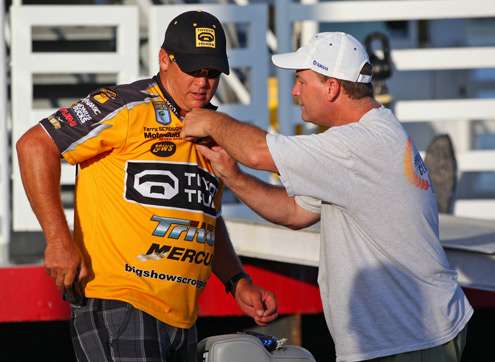 <p>
	Terry Scroggins gets hooked up for a day of fishing with a camera looking on.</p>
