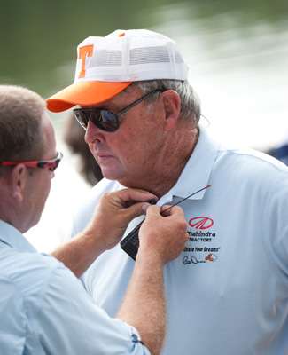 <p>
	ESPN cameraman puts a microphone on Bill Dance before the day gets started. </p>
