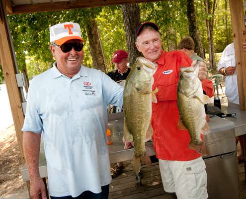 <p>
	Bill Dance and Jerry McKinnis hold up their big bass from the day. </p>
