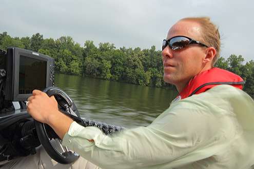 Aaron cruises the river hitting top speeds in his Phoenix boat with Mercury engine.
