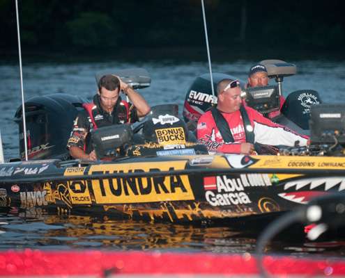 <p>
	Mike Iaconelli checks his gps system.</p>
