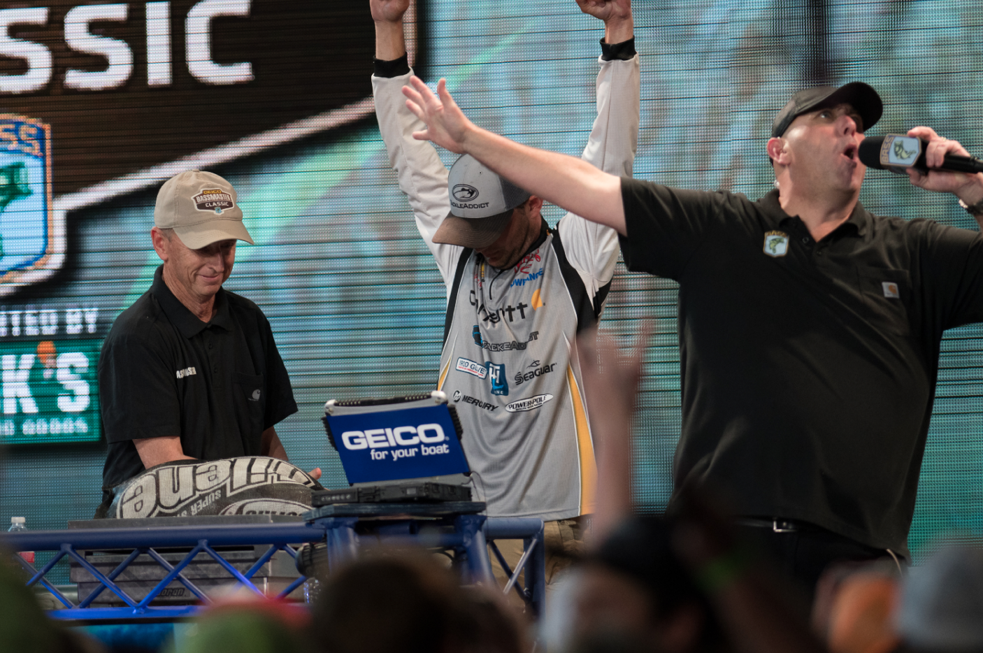 <h4<On-Stage or On-The-Water: The Future of Weigh-Ins</h4>
<B>The Bassmaster Texas Fest begs the question: Will on- the-water weigh-ins replace the stage?</b><BR>
For the past two years the Bassmaster Texas Fest and the Classic Bracket tournaments have used a new weigh-in format, calling on marshals (or judges) to weigh each of the competitorsâ keeper bass on the water. As a result, the BASSTrakk leaderboards were typically 100 percent accurate, and the majority of the fish were released immediately after being caught.<BR>
Missing was the excitement, hype, and dramatic reveal of on- stage weigh-ins.<BR>
Jordan Lee believes the idea behind the new format is a good one, but should never be used on the Elite Series. âI definitely see the good when it comes to fish care, but there are just too many variables when you are competing at the Elite level. When itâs a game of ounces, can you really trust 108 different marshals or competitors with different scales? Thereâs just too much on the line to not have everyone weigh on the same scale.â
