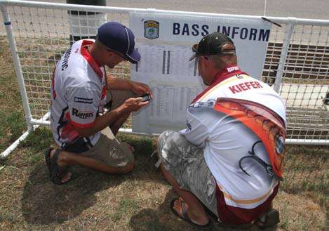 <p>
	The anglers check out to see who they are paired with on Day Two.</p>
