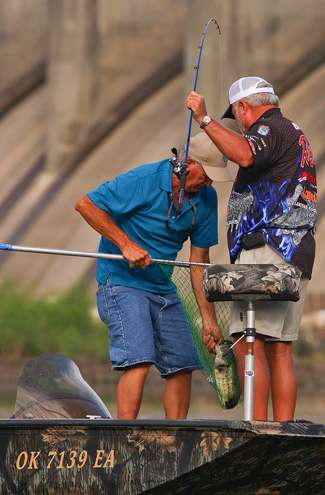 <p> 	 </p> <p> 	After nearly three hours of fishing, Biffle boats his first keeper bass. </p> 
