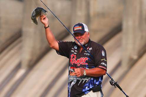 <p> 	 </p> <p> 	Biffle holds the keeper high for the cameras. </p> 