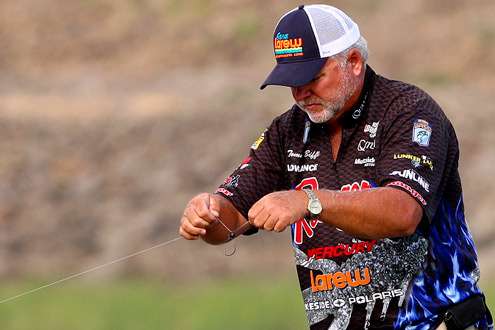 <p>
	 </p>
<p>
	Biffle pauses to re-tie before making another cast. </p>
