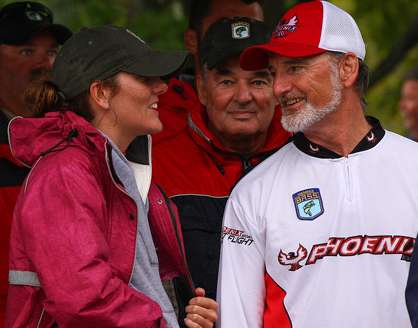 <p>
	Valerie Hicks chats with her dad as he goes through the weigh-in line at Oneida Lake.</p>
