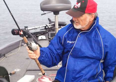 <p>
	Mark Hicks readies tackle for a day on Oneida Lake.</p>

