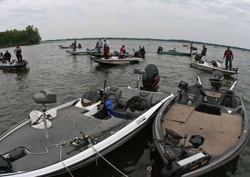 <p>
	Boats drift out off the shore, waiting for a spot to open up at the docks for weigh-in Friday.</p>
