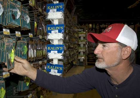 <p>
	Mark Hicks checks out some baits at Bass Pro Shop.</p>

