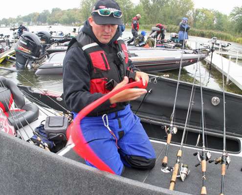 <p>
	Britt Myers puts rod sleeves on his rods before putting them away for the day.</p>

