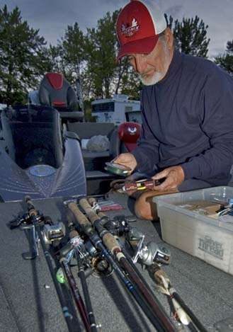 <p>
	 </p>
<p>
	Mark Hicks prepares tackle for the first day of the Oneida Lake Open.</p>
