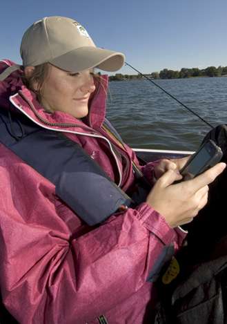 <p>
	Val stays connected with her friends throughout the practice day.</p>
