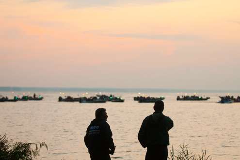 <p>
	Bassmaster fans watch as the boats take-off.</p>

