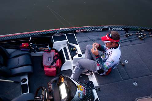 <p> 	Stephen Browning ties some baits before starting the third day on the Arkansas River. </p> 