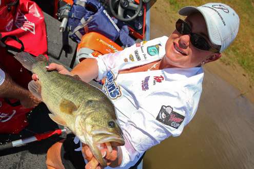 <p>
	Janet Parker of Little Elm, Texas, displays one of the bass that helped her take second place on Day One with a total of 15-2.</p>
