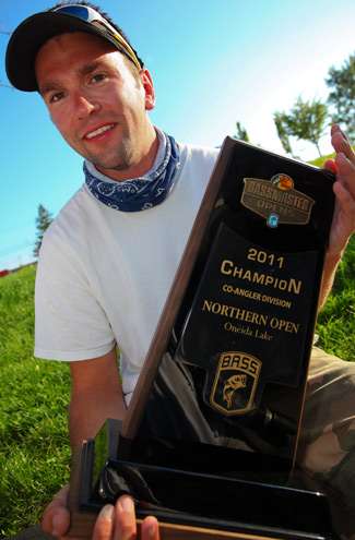 <p>
	Kevin Haley proudly holds his co-angler trophy for the B.A.S.S. photographers. </p>
