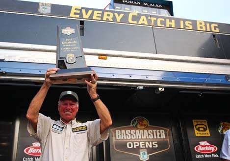 <p>
	Fleishmann is named the co-angler champion and hoists the trophy over his head.</p>
